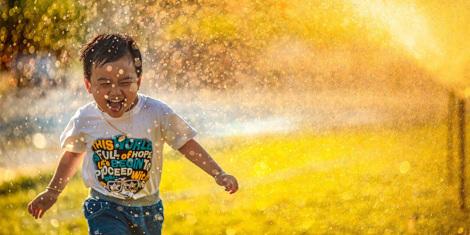 kid playing in water